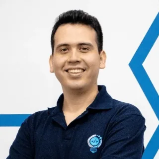 Portrait of Luis Vargas smiling, wearing a navy DevelTwist polo